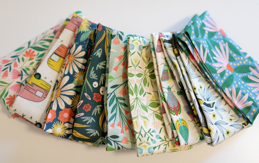 Fan of colorful tea towels on a table