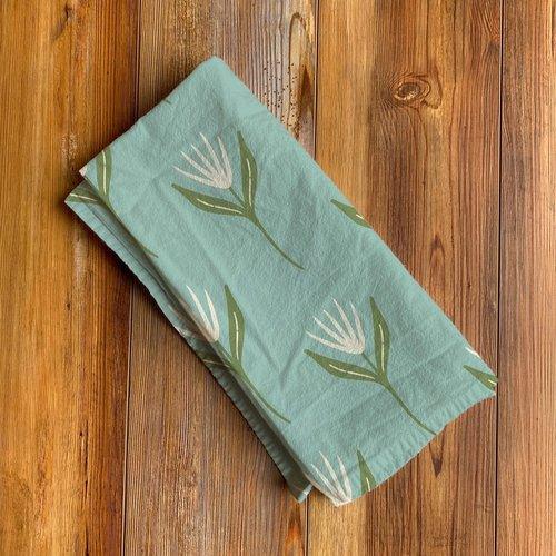 Almost Spring Tea Towel - Folded Almost Spring tea towel by Rebecca Jane Woolbright with soft floral pattern
