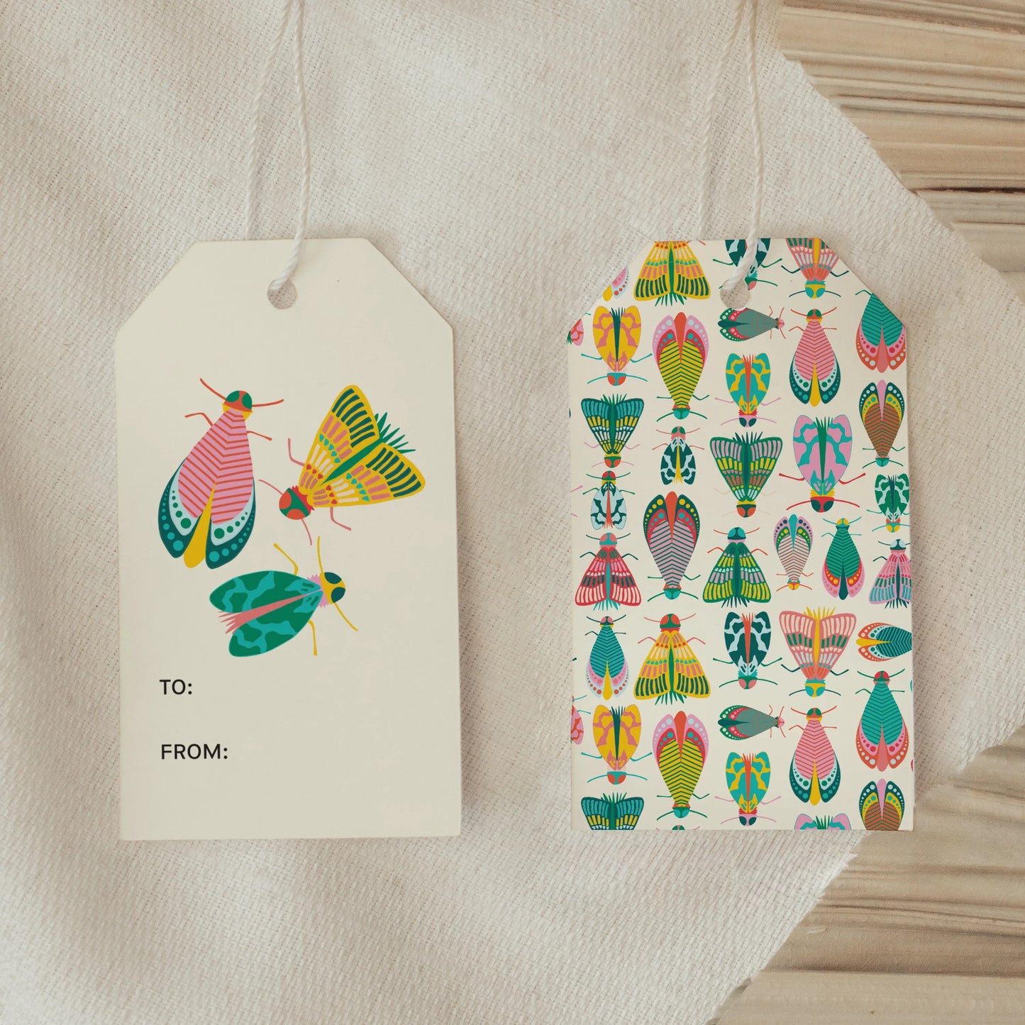Front and back view of Dancing Bugs Gift Tags showing bright moth artwork and colorful bug patterned back