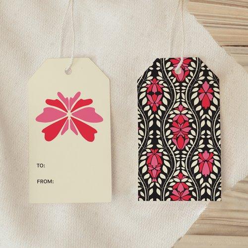 Front and back view of Glowing Garden Gate Gift Tag showing bright pink floral front and black botanical patterned back
