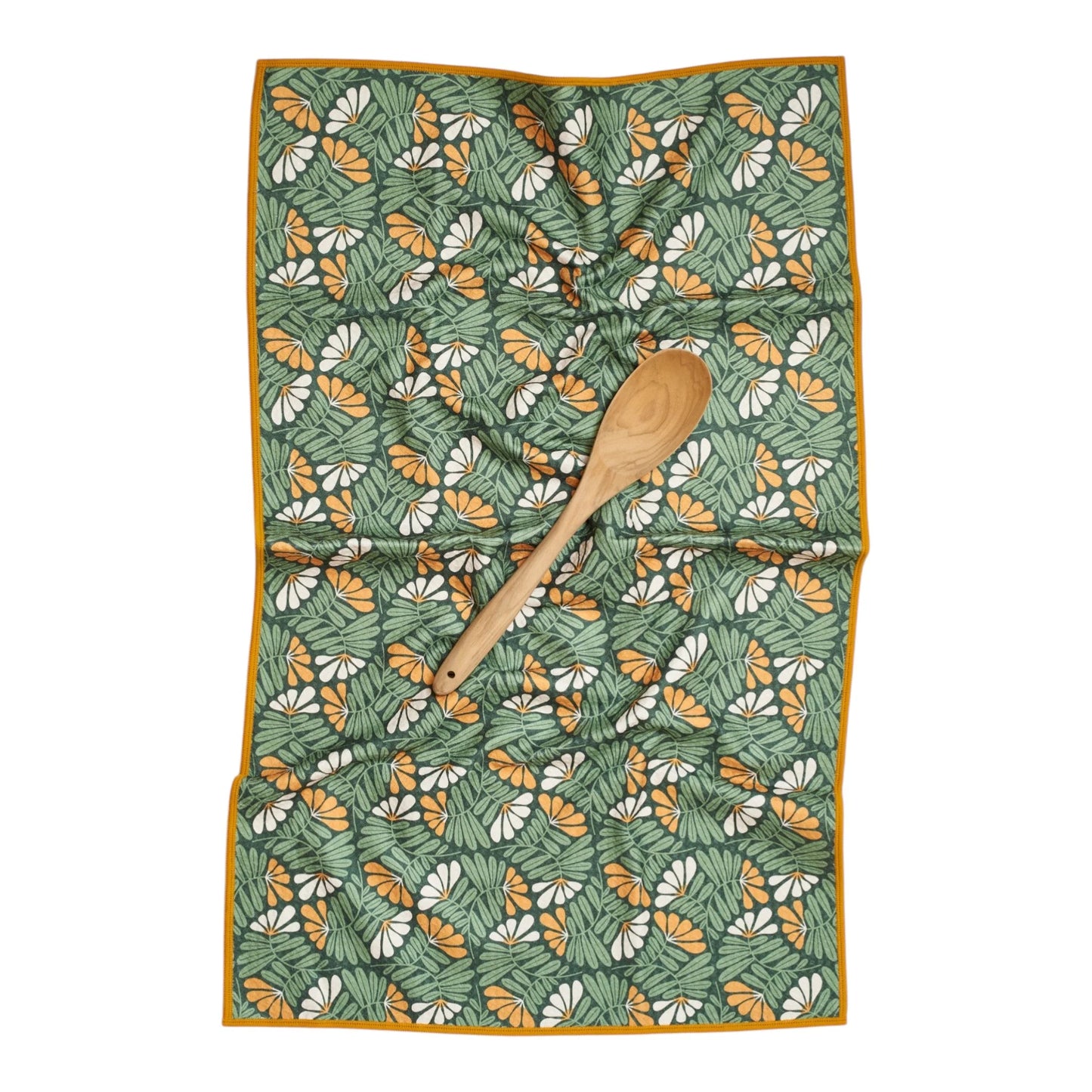 Floral patterned towel with a wooden spoon on a white background