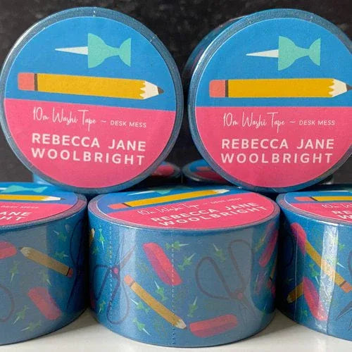 desk mess washi tape that is blue with a pencil and push pin