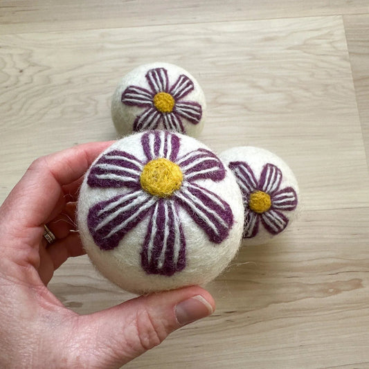 Wool Dryer Balls with purple flowers from Rebecca Jane Woolbright and Once Again Home Co.