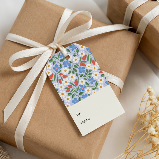 Floral illustrated gift tag on a brown kraft wrapped box