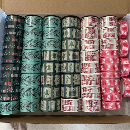 rolls of washi tape stacked in a box
