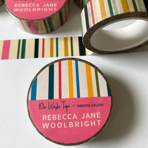 rolls of striped washi tape, one reads Ribbons Galore Rebecca Jane Woolbright