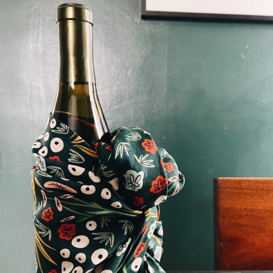wine bottle wrapped with tea towel