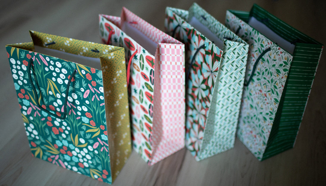 A row of colorful gift bags with different patterns