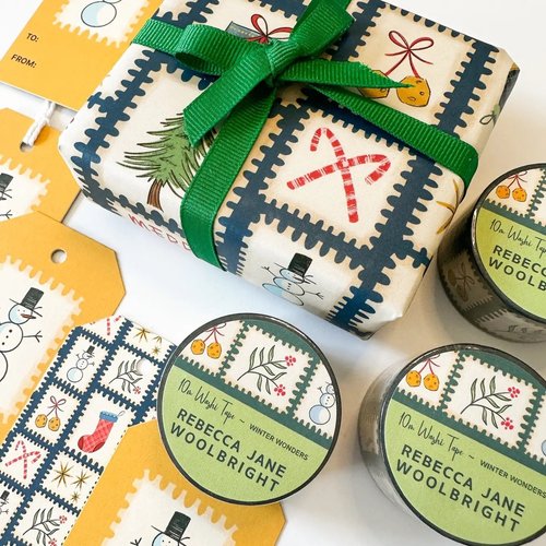 Dear Santa Gift Tag styled with matching holiday postage stamp wrapping paper by Rebecca Jane Woolbright