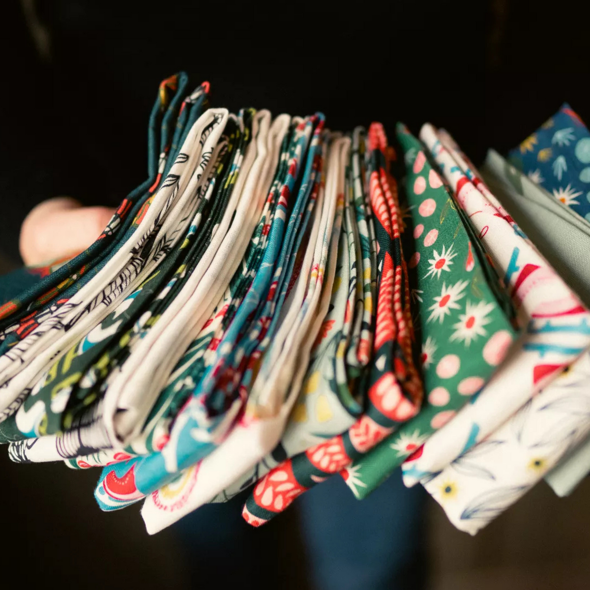 A stack of colorful tea towels