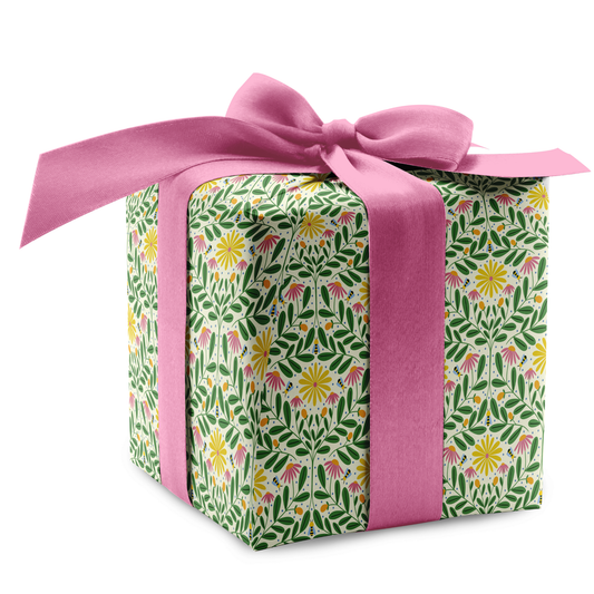 Bee Kind floral wrapping paper on wrapped present with pink ribbon, spring gift wrap with bees and flowers