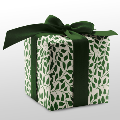 Green botanical gift wrap on wrapped present with dark green ribbon, In the Thicket wrapping pape