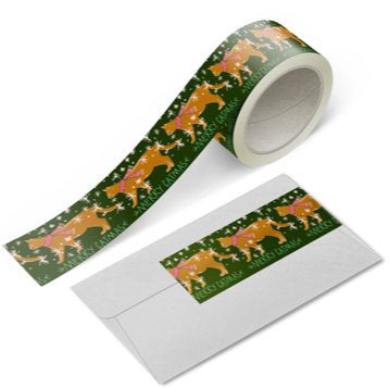 Merry Catmas 1 Inch Washi Tape roll with illustrated cat, scarf, snowflakes, and holiday lettering by Rebecca Jane Woolbright.