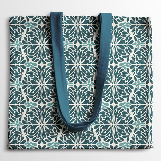 Tote bag with geometric pattern and blue handles on a light white background
