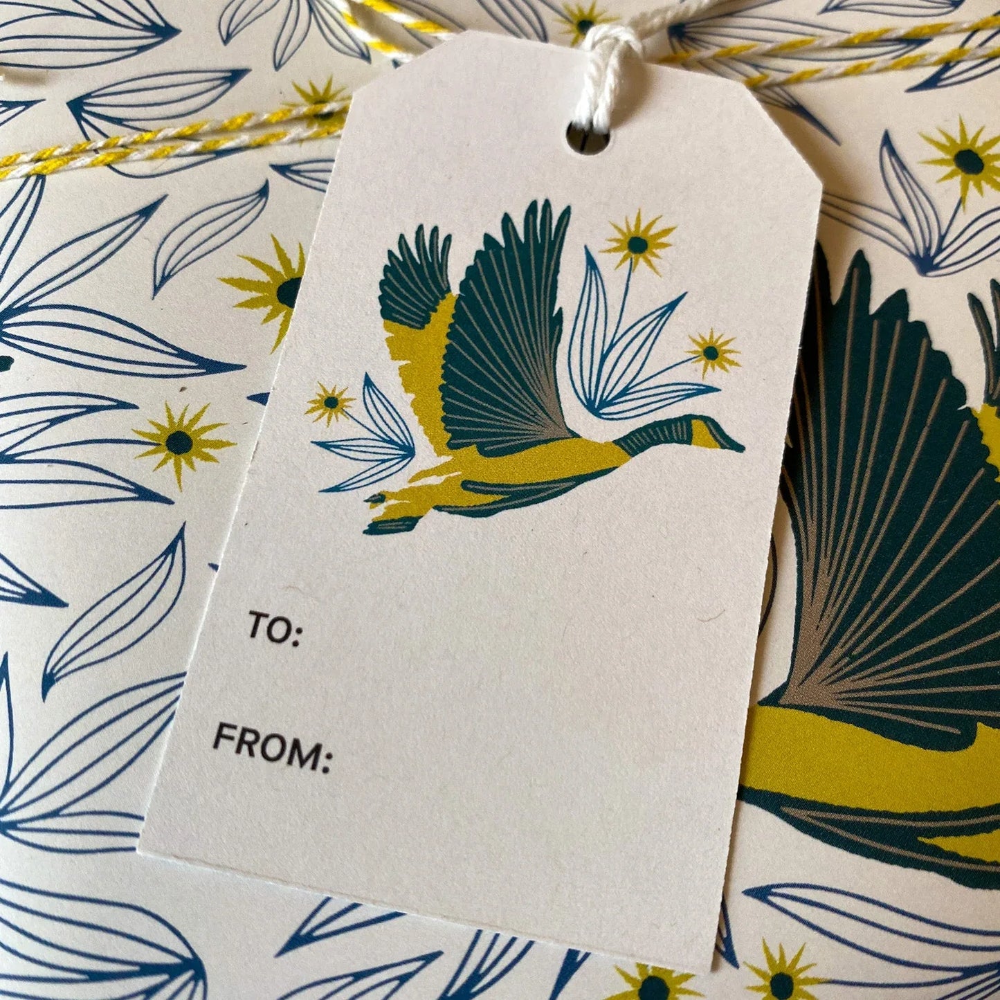 Wingspan Gift Tag styled with matching bird wrapping paper by Rebecca Jane Woolbright