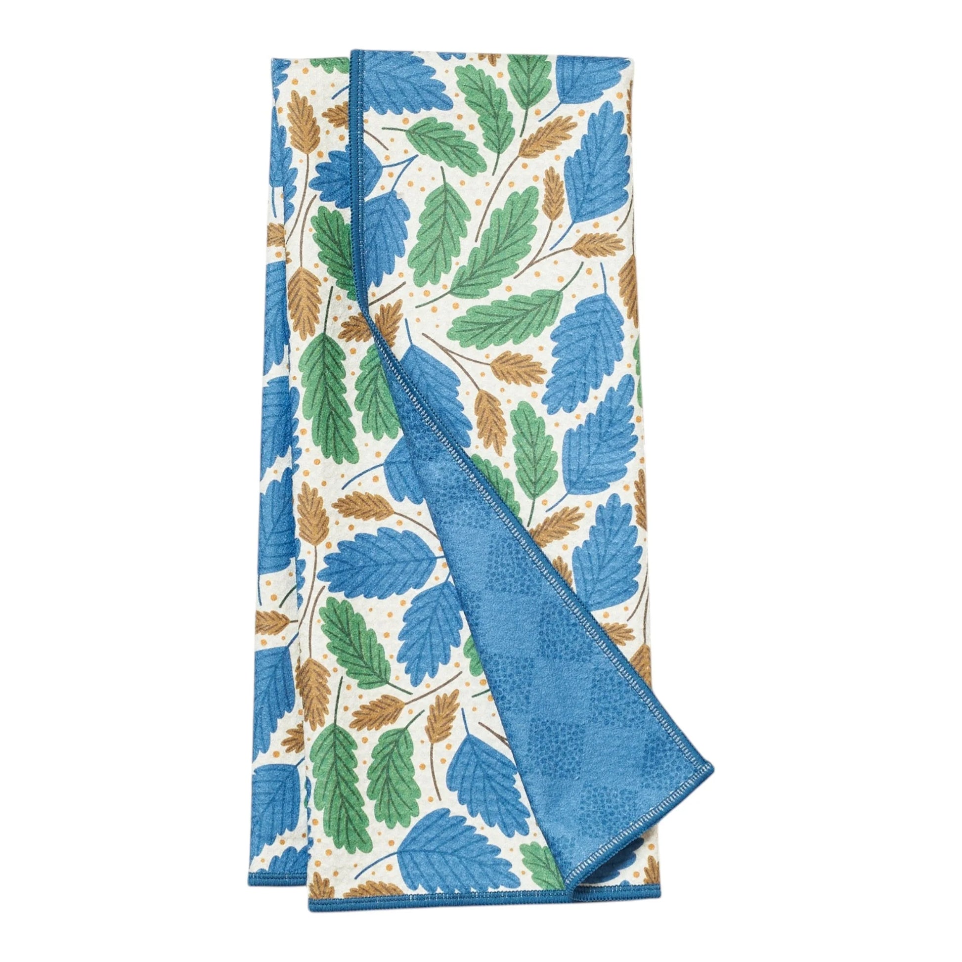 Patterned kitchen towel with leaf designs on a white background