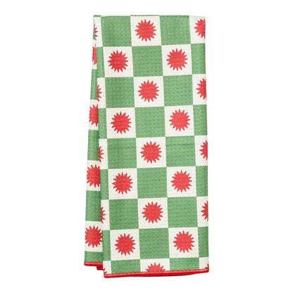 Green and white checkered towel with red star patterns on a white background