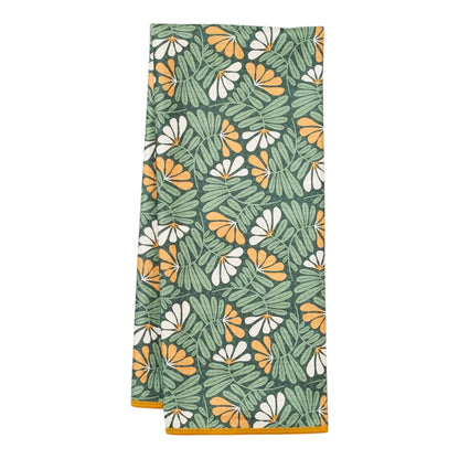 Towel with tropical leaf pattern on a white background