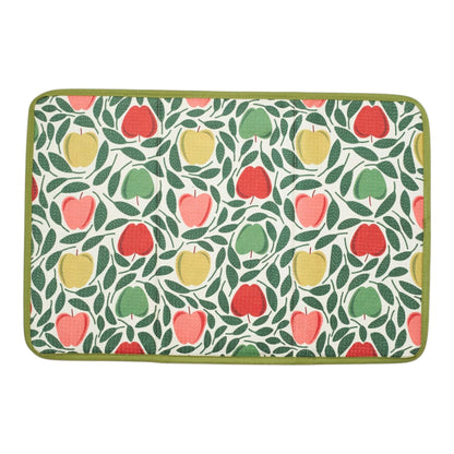 Patterned drying mat with red, green, and yellow apples on a white background