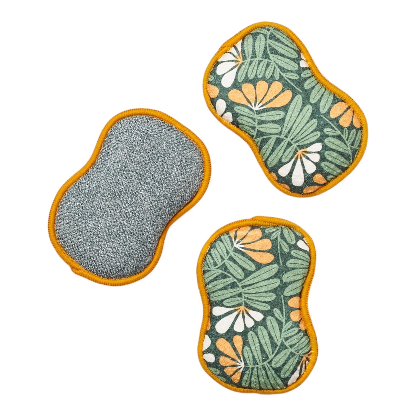 Three sponges with different patterns on a white background