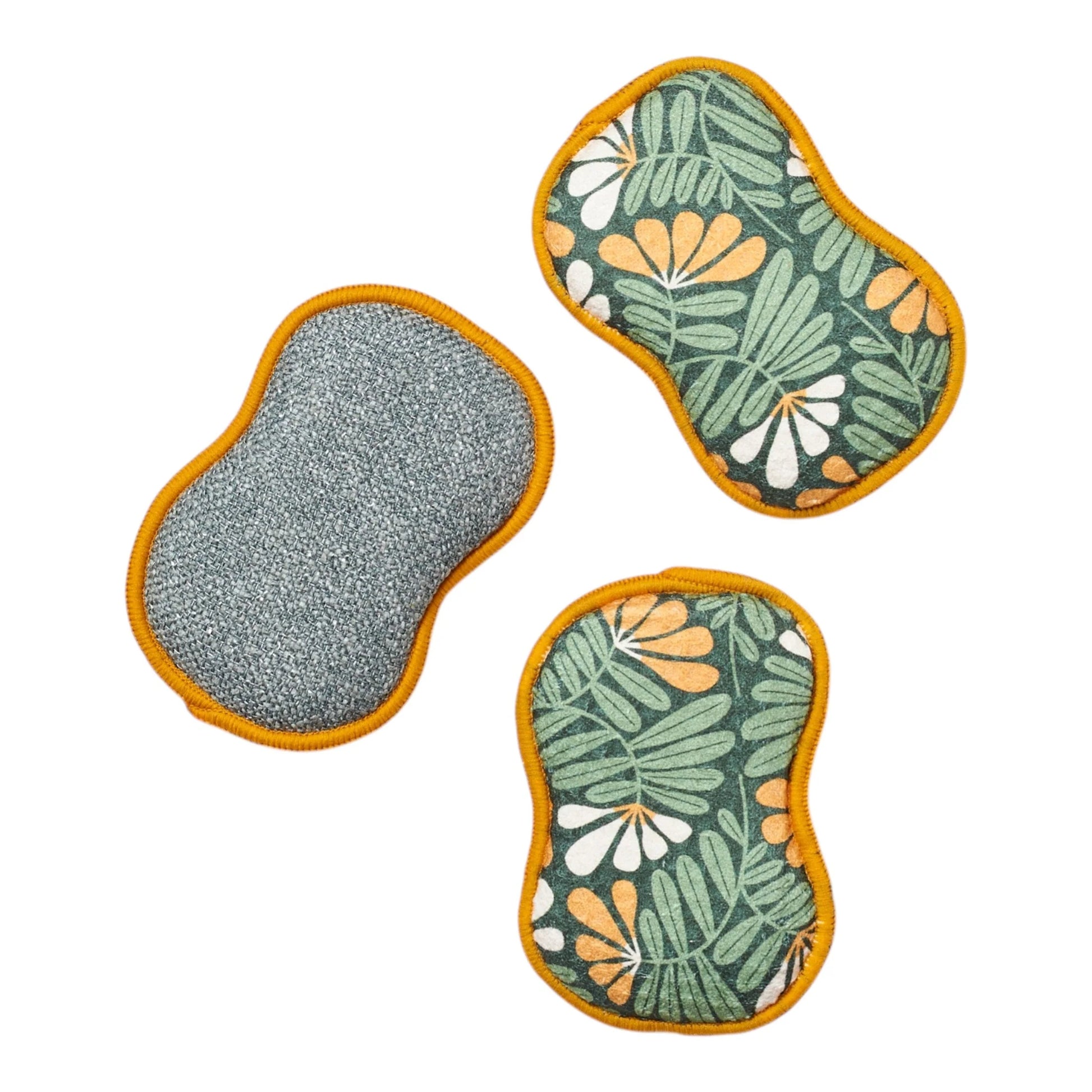 Three sponges with different patterns on a white background
